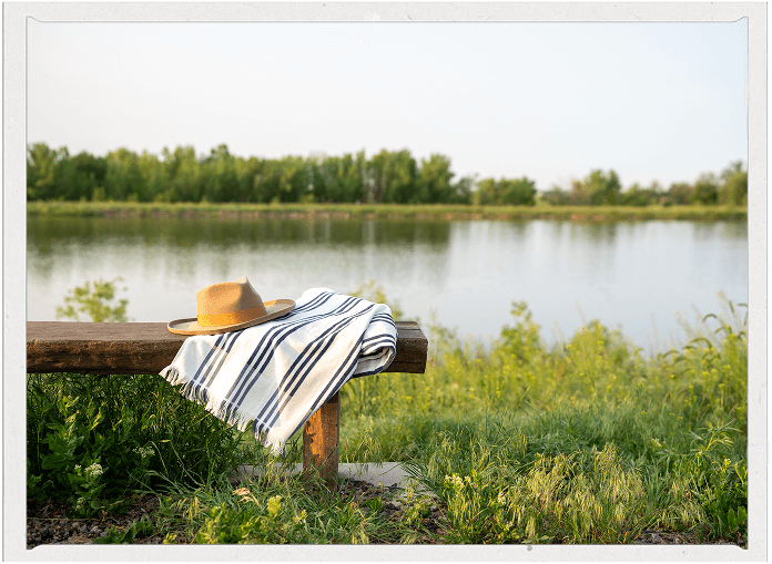 Bench near lake in Barefoot Community located in Firestone, Colorado